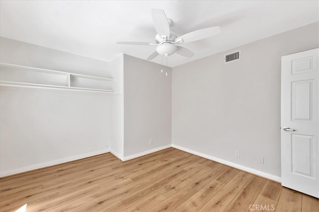 23772 Cll Hogar Mission Viejo, CA 92691 - Photo 24 of 30 a view of an empty room with wooden floor