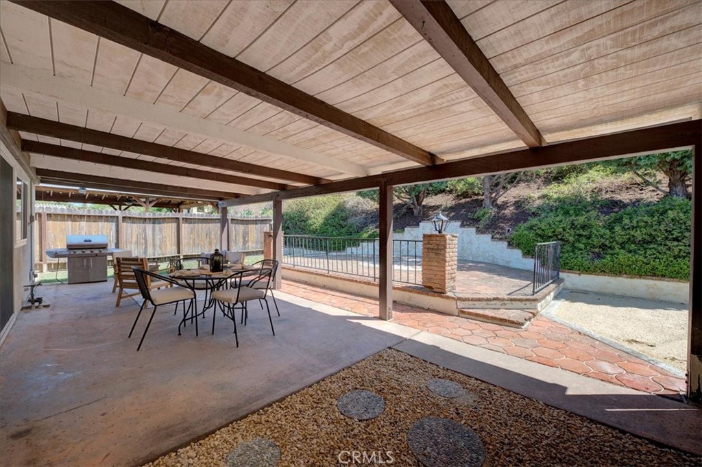 23772 Cll Hogar Mission Viejo, CA 92691 - Photo 28 of 30 a dining room with furniture and a garden