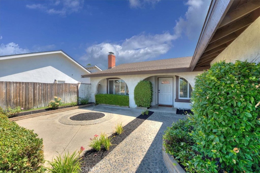 23772 Cll Hogar Mission Viejo, CA 92691 - Photo 3 of 30 a front view of a house with garden