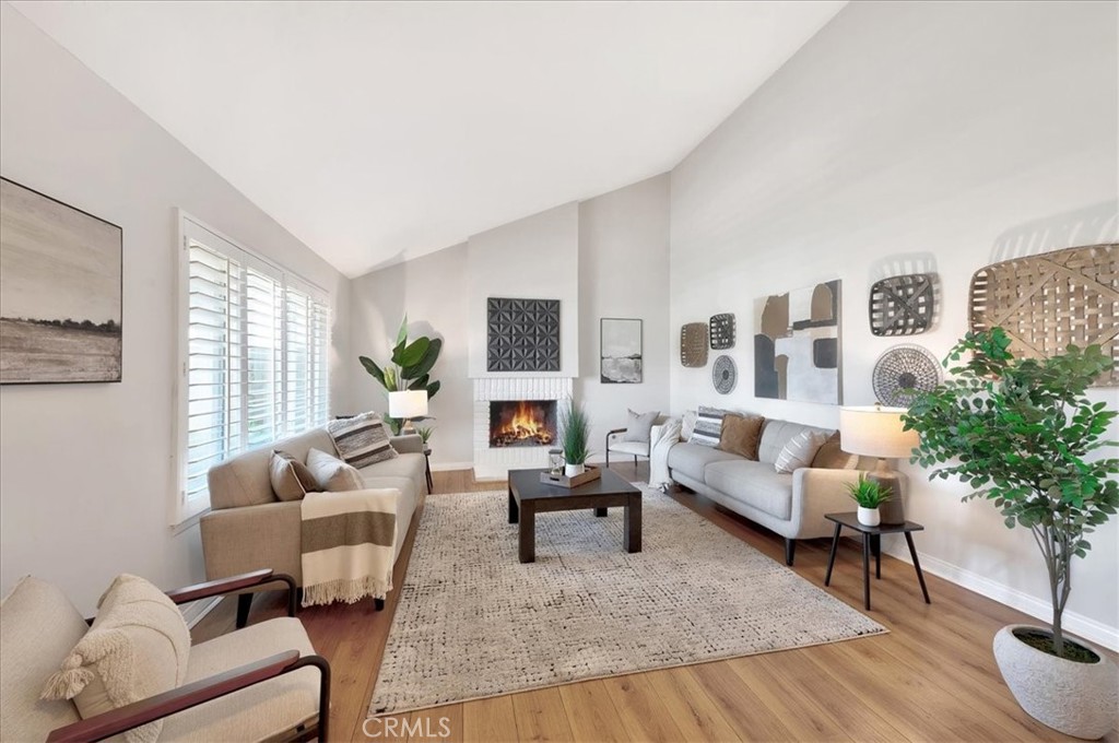 23772 Cll Hogar Mission Viejo, CA 92691 - Photo 4 of 30 a living room with furniture and a potted plant