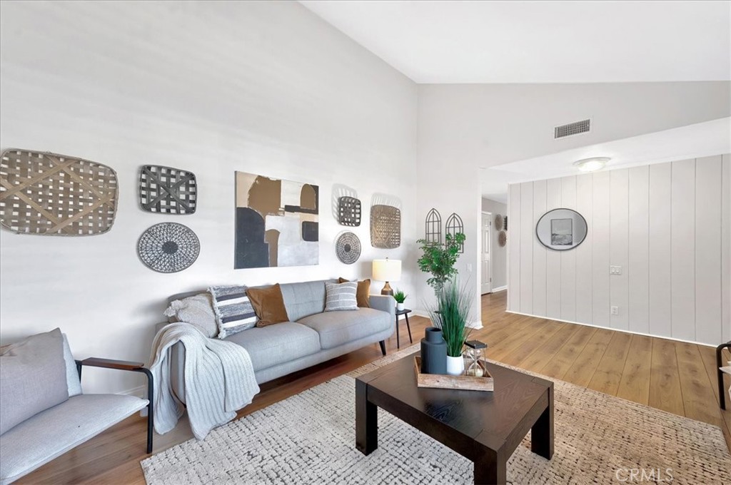 23772 Cll Hogar Mission Viejo, CA 92691 - Photo 5 of 30 a living room with furniture and wooden floor