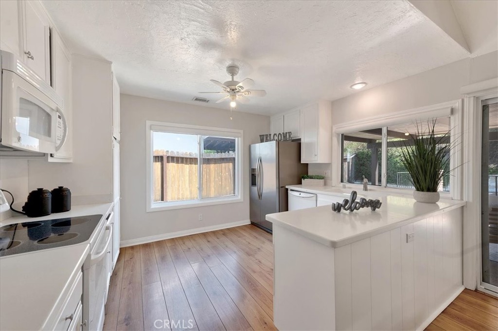 23772 Cll Hogar Mission Viejo, CA 92691 - Photo 10 of 30 a kitchen with a sink appliances and cabinets