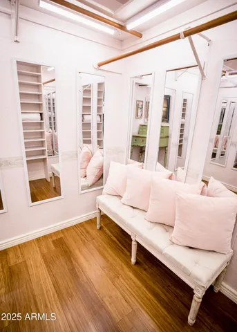 a bedroom with furniture and a flat screen tv