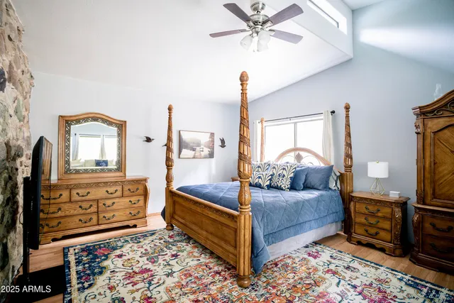 a view of a patio with table and chairs potted plants with wooden floor and fence