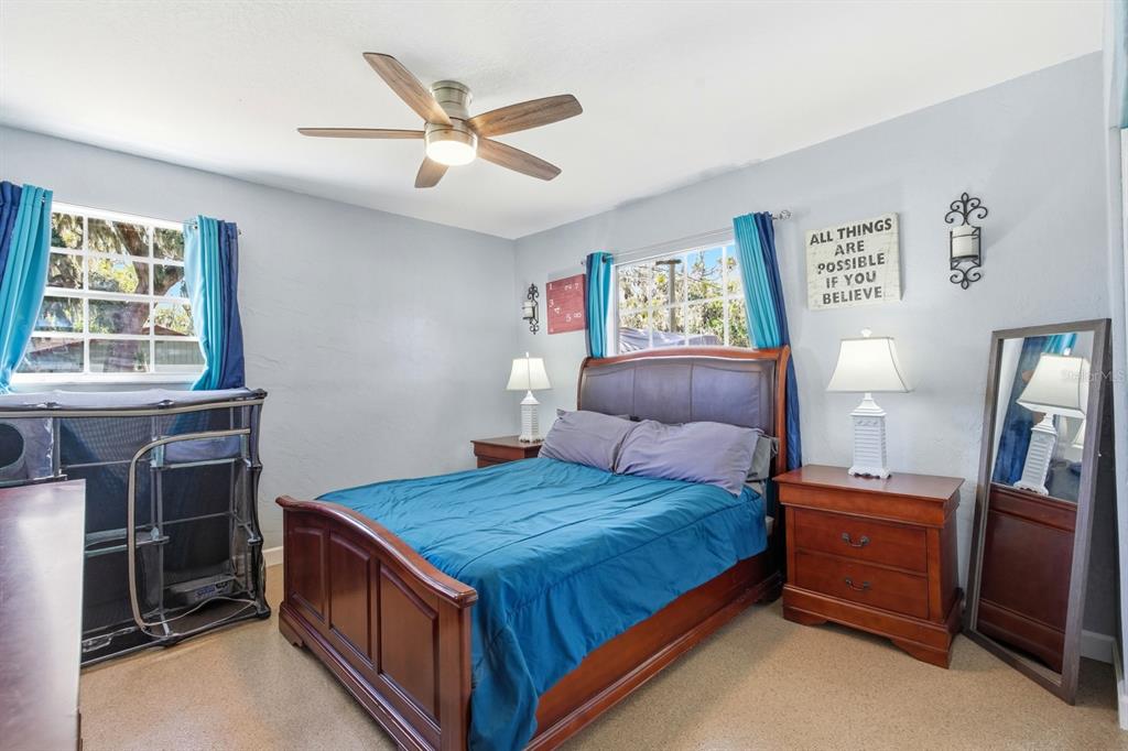 2329 Lime Tree Drive Edgewater, FL 32141 - Photo 12 of 22 a bedroom with a bed and a window