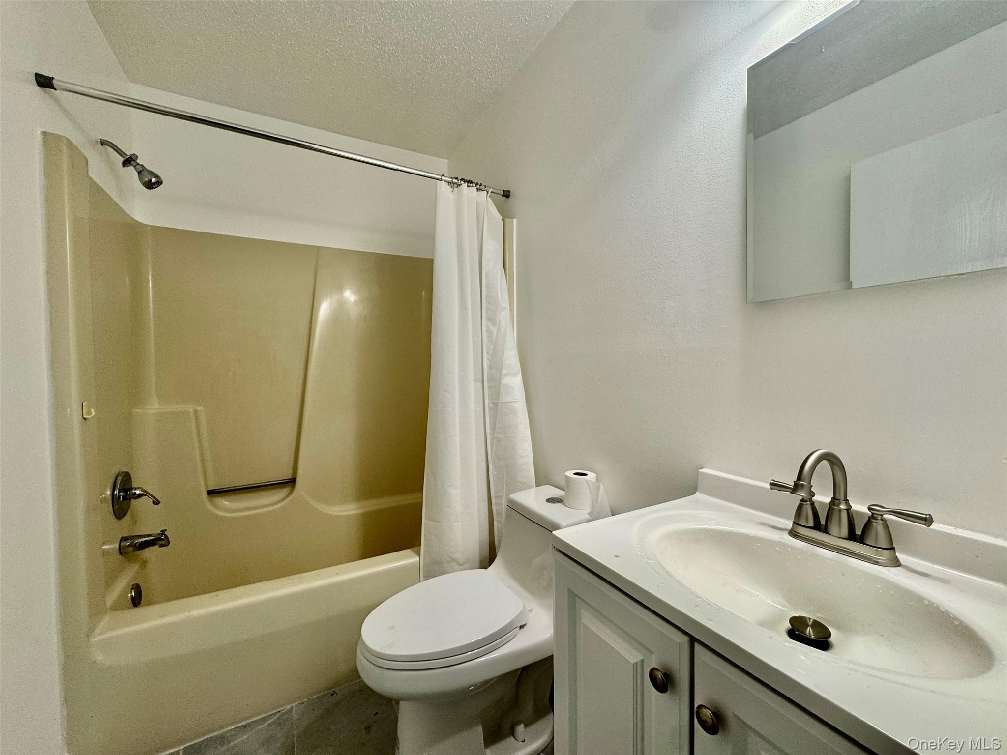 52 Boxbaum Road Sparrowbush, NY 12780 - Photo 16 of 23 a bathroom with a sink toilet and shower