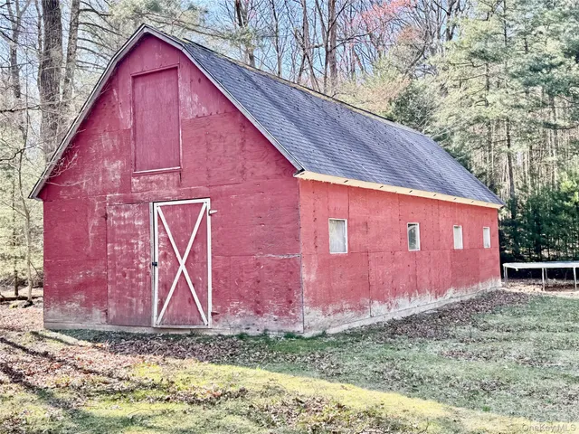 a view of a room with wooden furniture