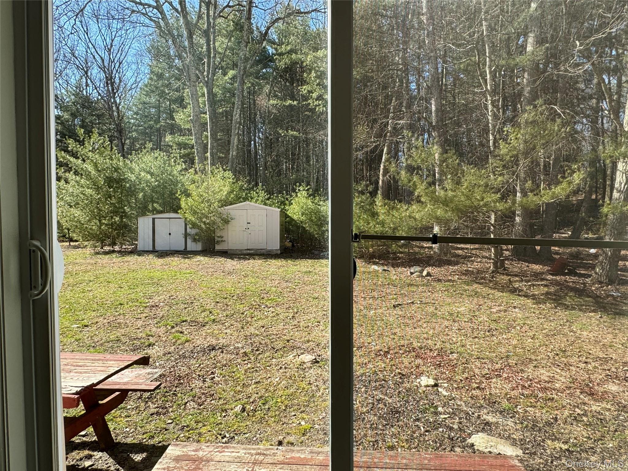52 Boxbaum Road Sparrowbush, NY 12780 - Photo 4 of 23 a view of a yard from a window