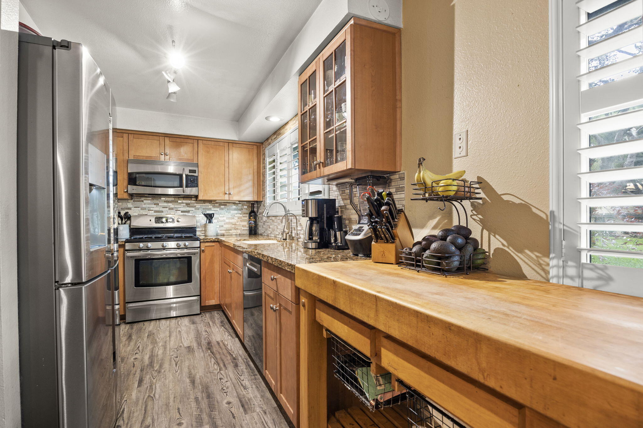 4413 Catlin Circle, Unit B Carpinteria, CA 93013 - Photo 12 of 23 a kitchen with stainless steel appliances a refrigerator and a stove top oven