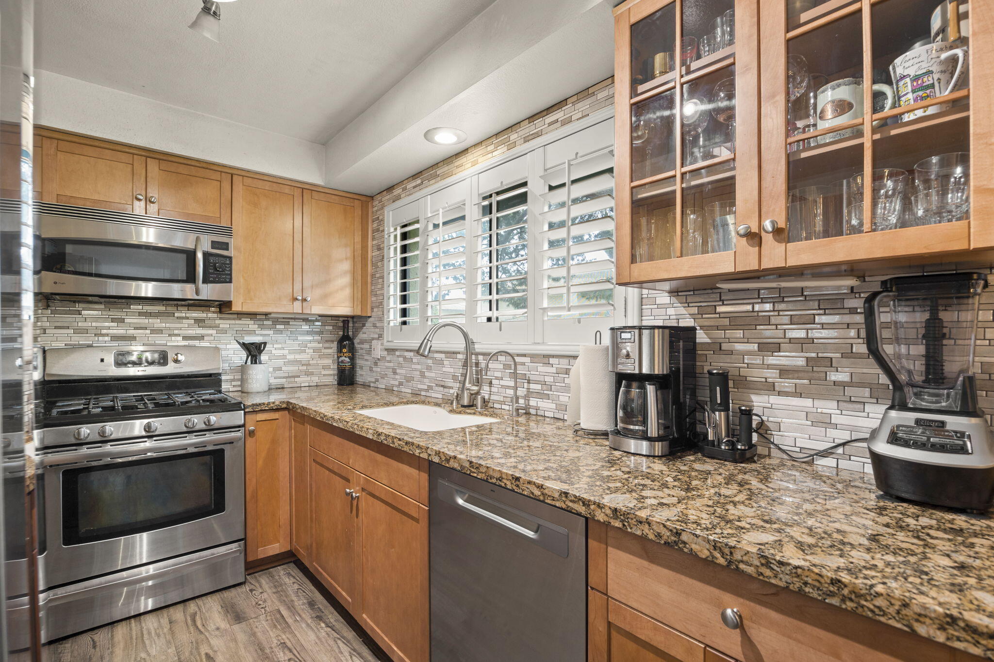 4413 Catlin Circle, Unit B Carpinteria, CA 93013 - Photo 13 of 23 a kitchen with stainless steel appliances granite countertop a sink stove and oven