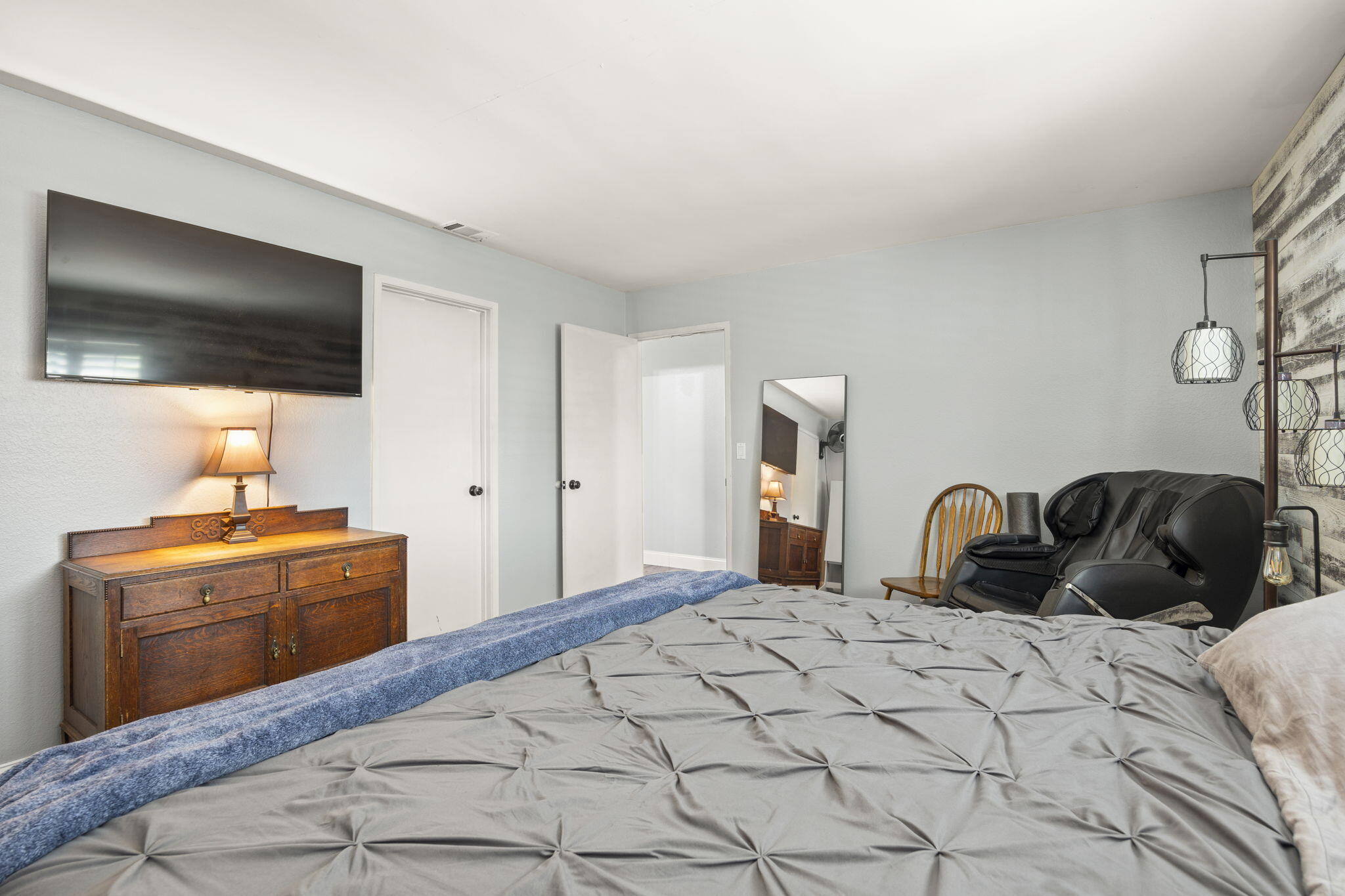 4413 Catlin Circle, Unit B Carpinteria, CA 93013 - Photo 16 of 23 a bedroom with a bed and a flat screen tv