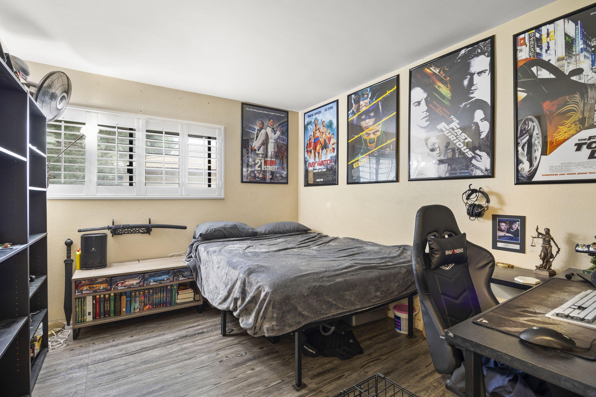 4413 Catlin Circle, Unit B Carpinteria, CA 93013 - Photo 18 of 23 a bedroom with a bed and wooden floor