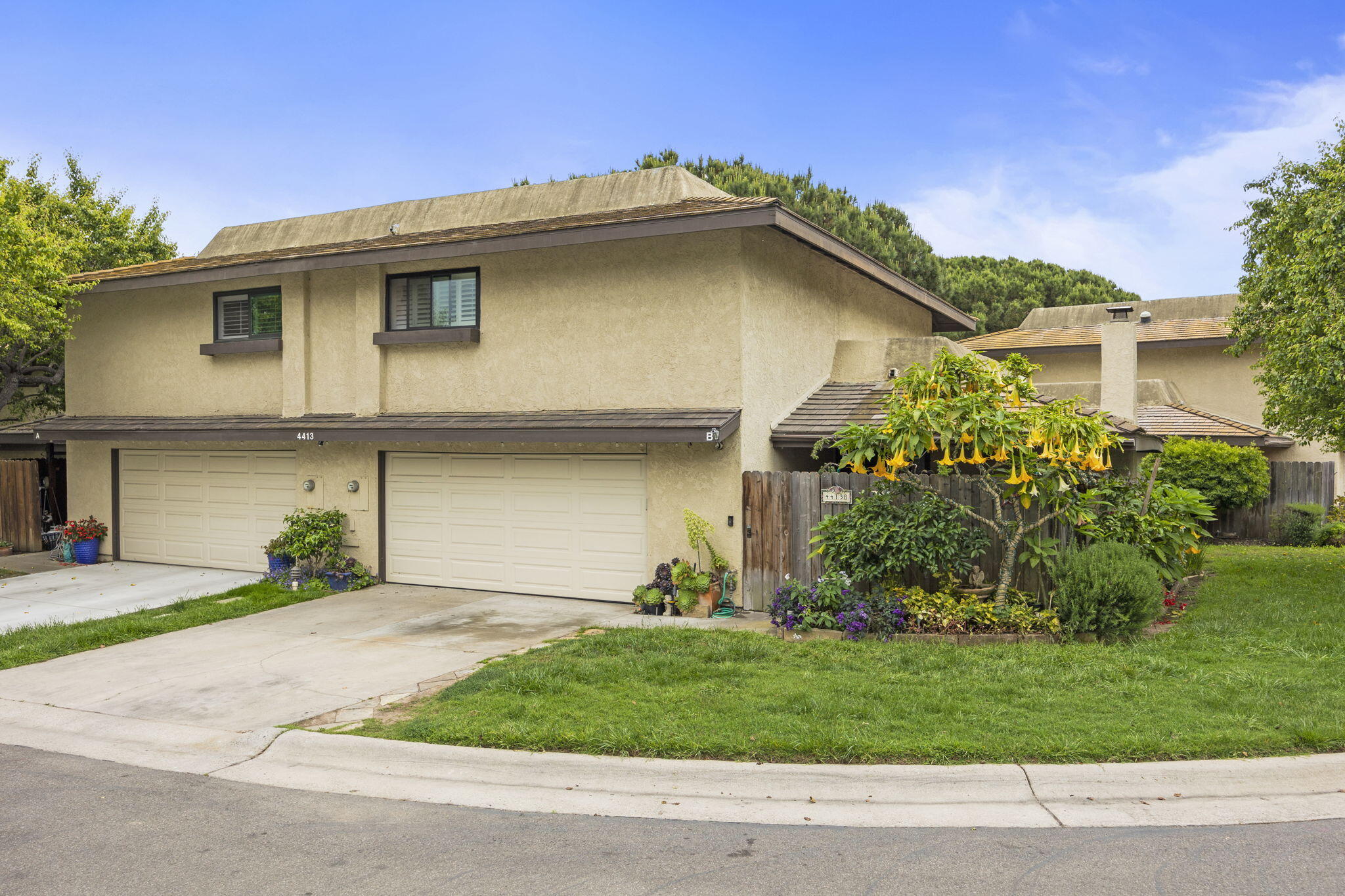 4413 Catlin Circle, Unit B Carpinteria, CA 93013 - Photo 3 of 23 a front view of a house with a garden