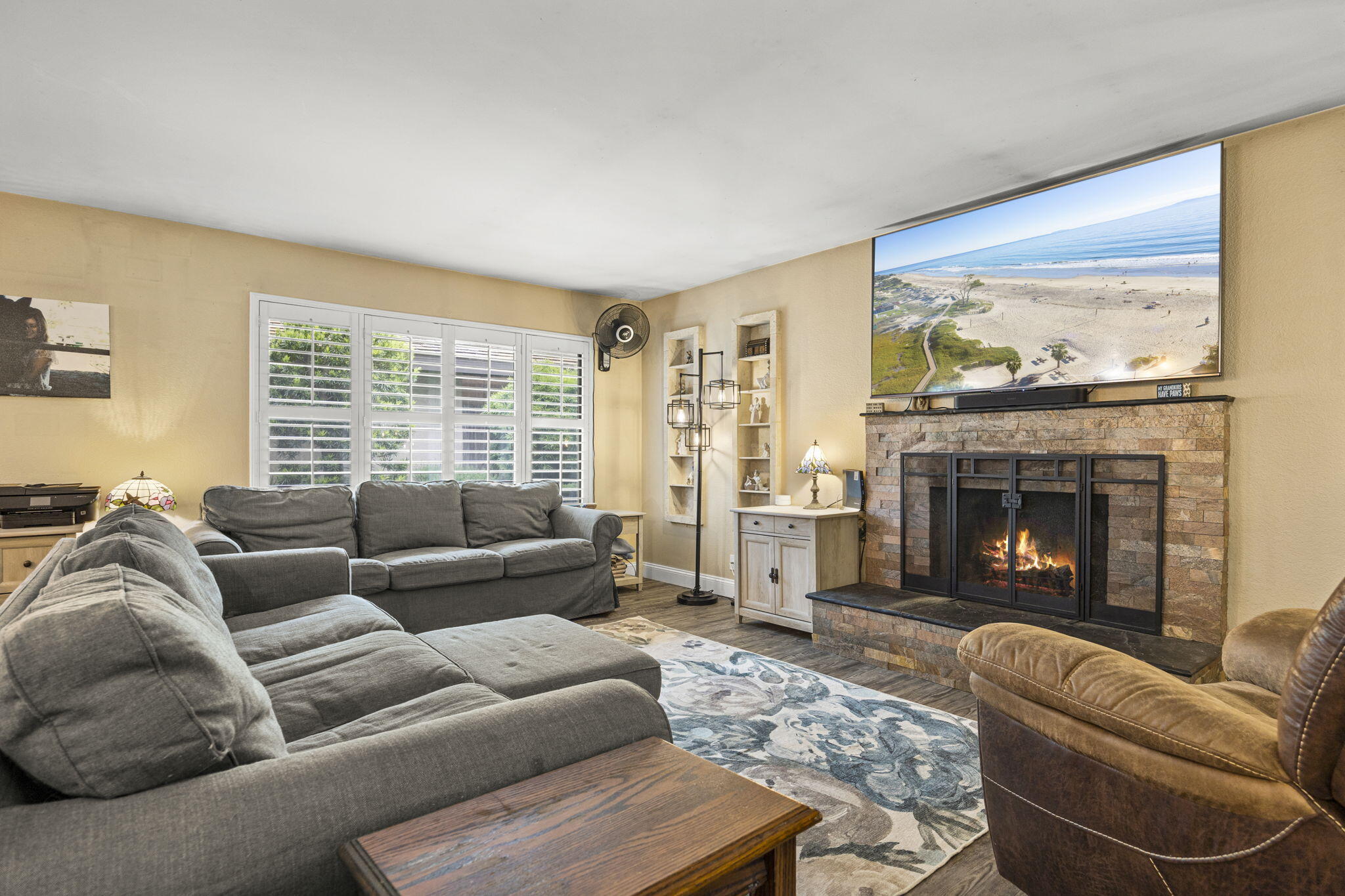 4413 Catlin Circle, Unit B Carpinteria, CA 93013 - Photo 6 of 23 a living room with furniture window and a fireplace