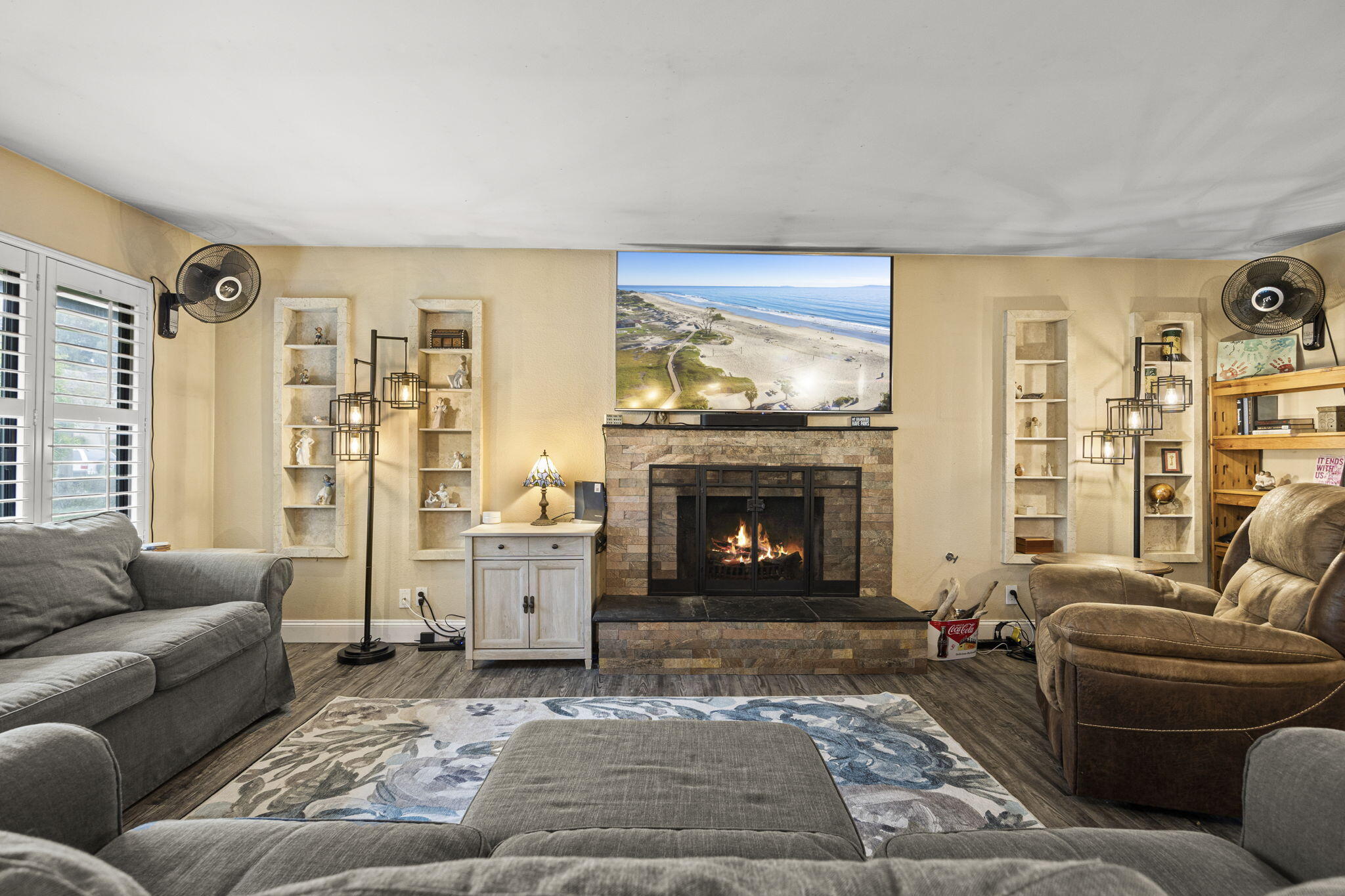 4413 Catlin Circle, Unit B Carpinteria, CA 93013 - Photo 7 of 23 a living room with furniture and a fireplace