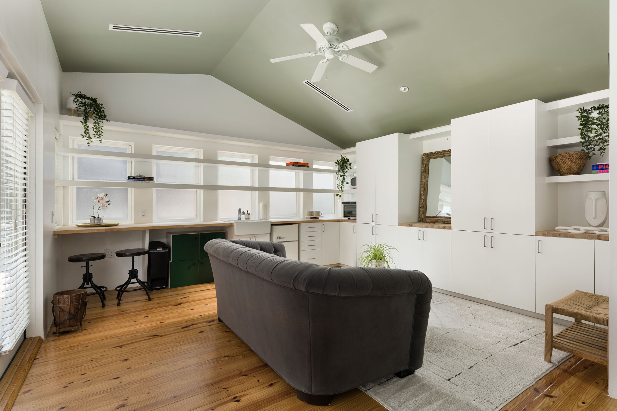 1704 Wethersfield Road Austin, TX 78703 - Photo 25 of 31 This spacious living area features a vaulted ceiling, hardwood floors, and a ceiling fan