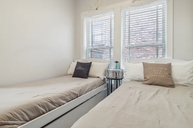 a table and chairs in wooden floor