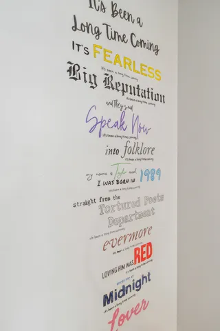 a living room with furniture a flat screen tv and a window