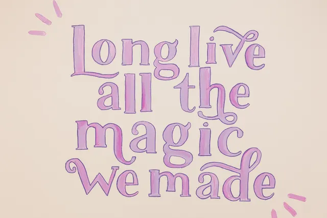 a glass vase with flowers on a table