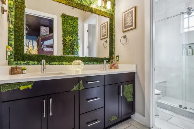 a bathroom with a sink mirror vanity and toilet
