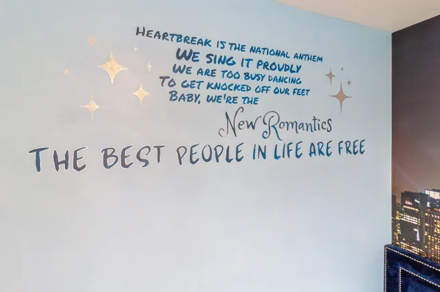 a view of walk in closet with clothes