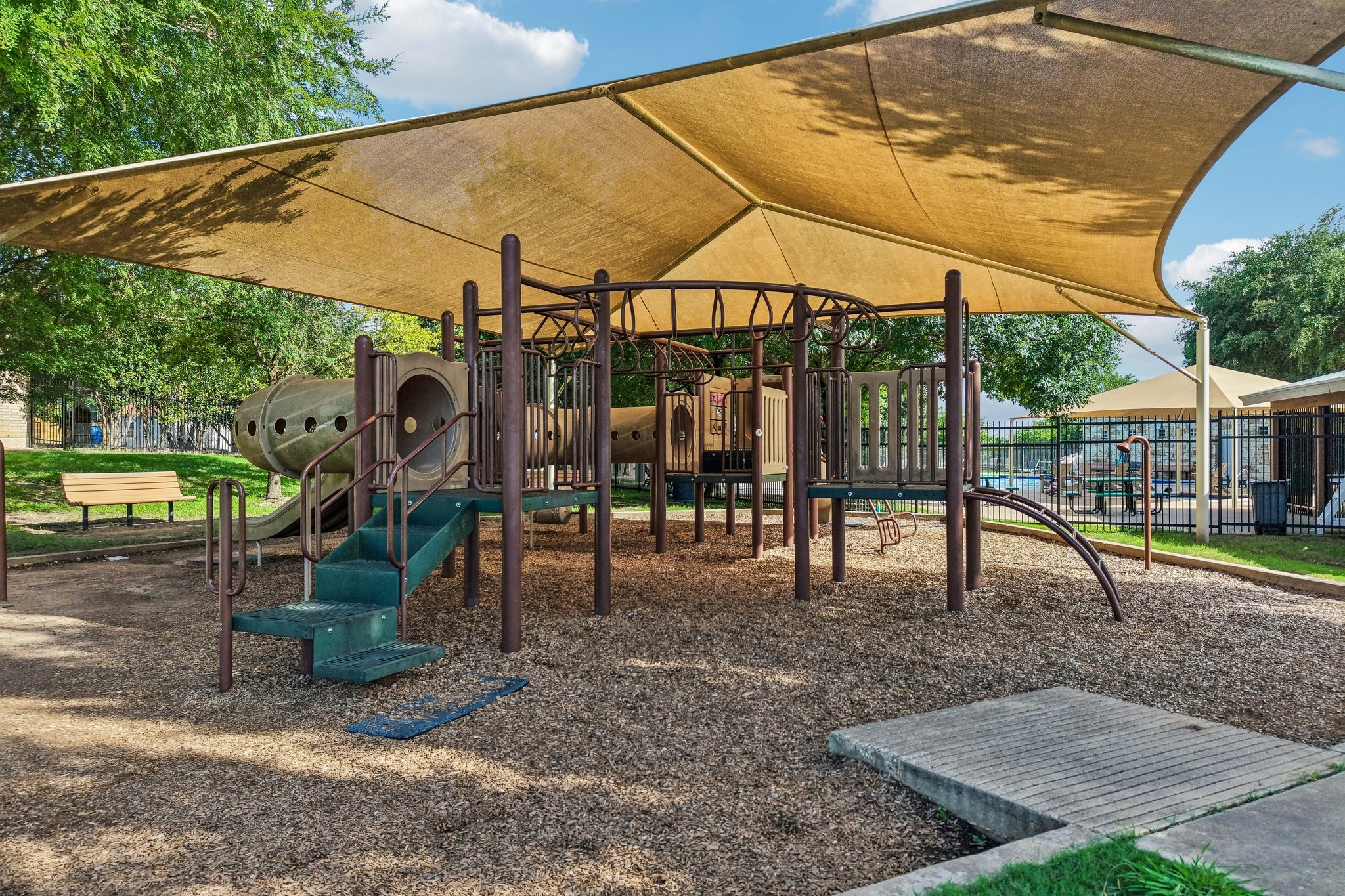 1721 Long Rifle Drive Austin, TX 78754 - Photo 34 of 38 A well-shaded playground area offers a perfect spot for recreation.