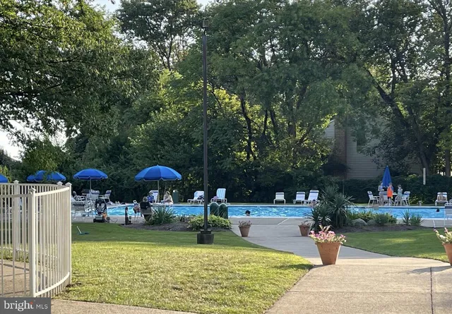 a view of a swimming pool with a patio