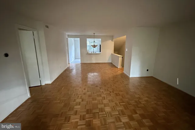 a view of a big room with windows and closet