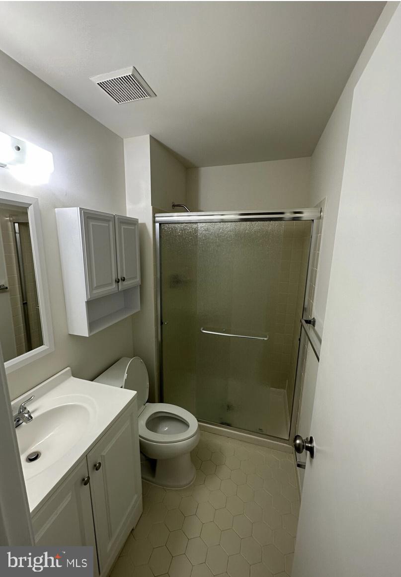 1002 Valley Glen Road, Unit 239 Elkins Park, PA 19027 - Photo 10 of 13 a bathroom with a sink toilet and shower