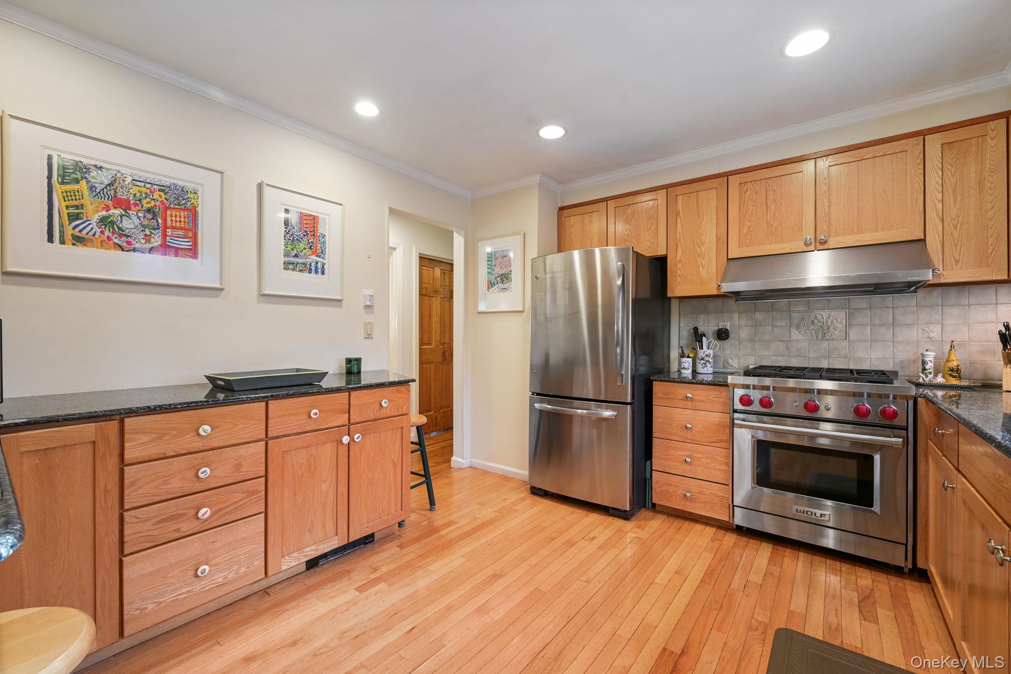54 Lockwood Road South Salem, NY 10590 - Photo 11 of 46 a kitchen with stainless steel appliances granite countertop a refrigerator and a stove top oven