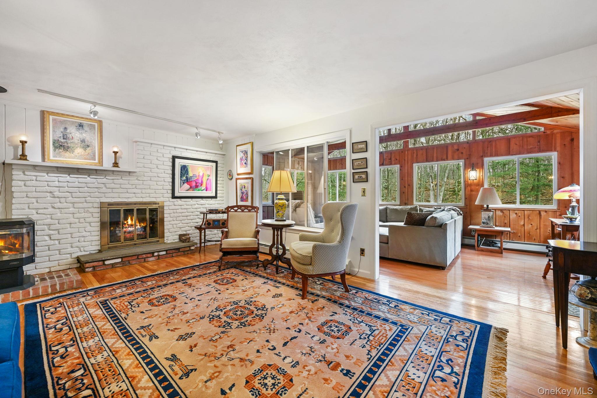 54 Lockwood Road South Salem, NY 10590 - Photo 19 of 46 a living room with furniture windows and a fireplace