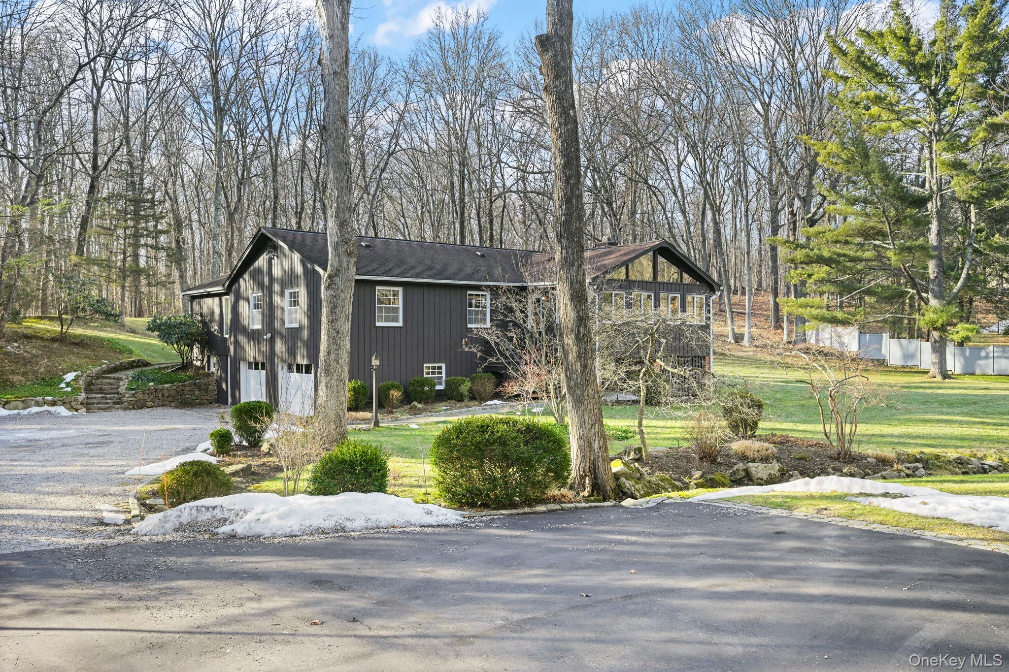 54 Lockwood Road South Salem, NY 10590 - Photo 2 of 46 a front view of a house with a yard and garage
