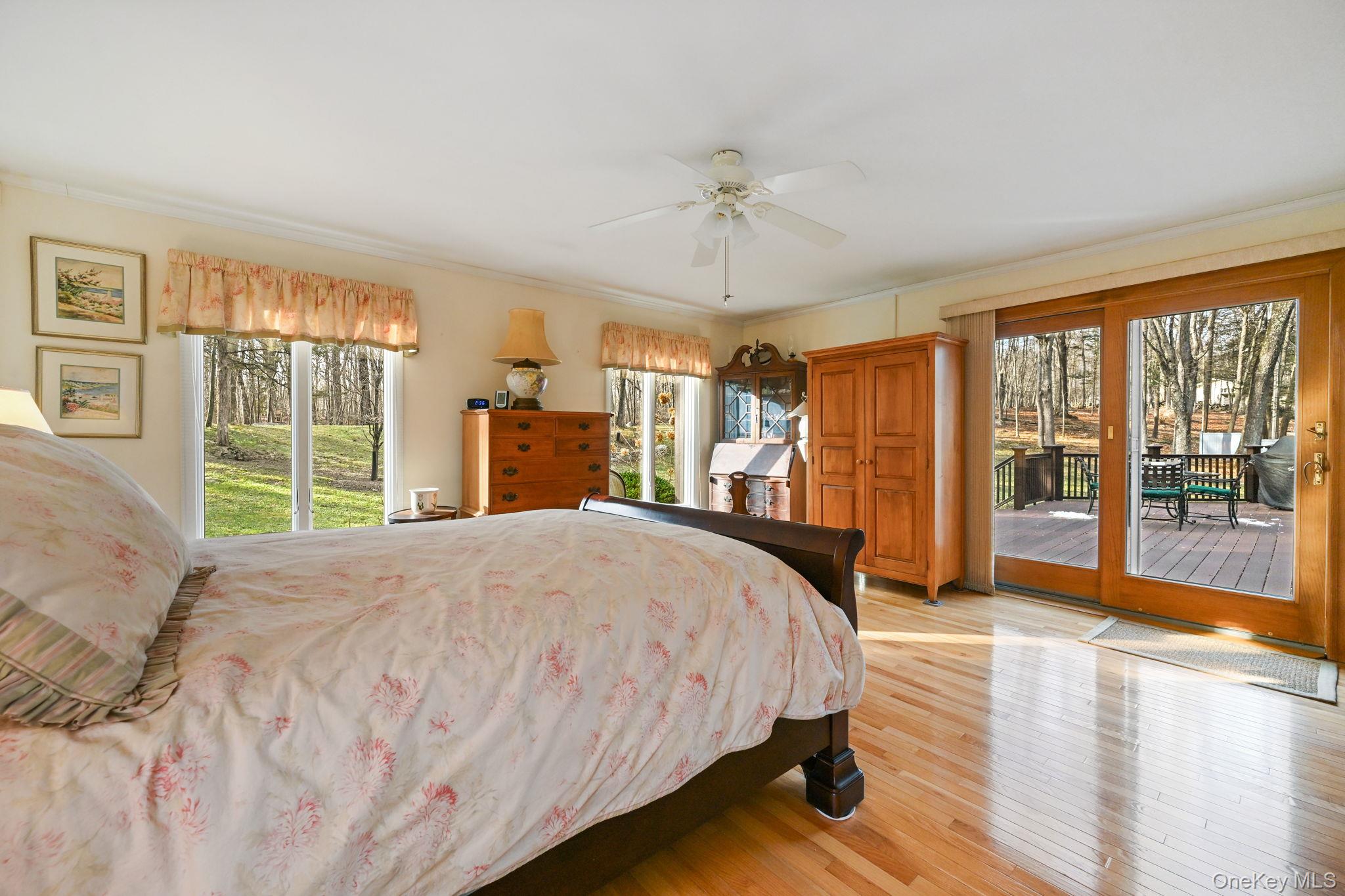 54 Lockwood Road South Salem, NY 10590 - Photo 23 of 46 a spacious bedroom with a large bed and a large window