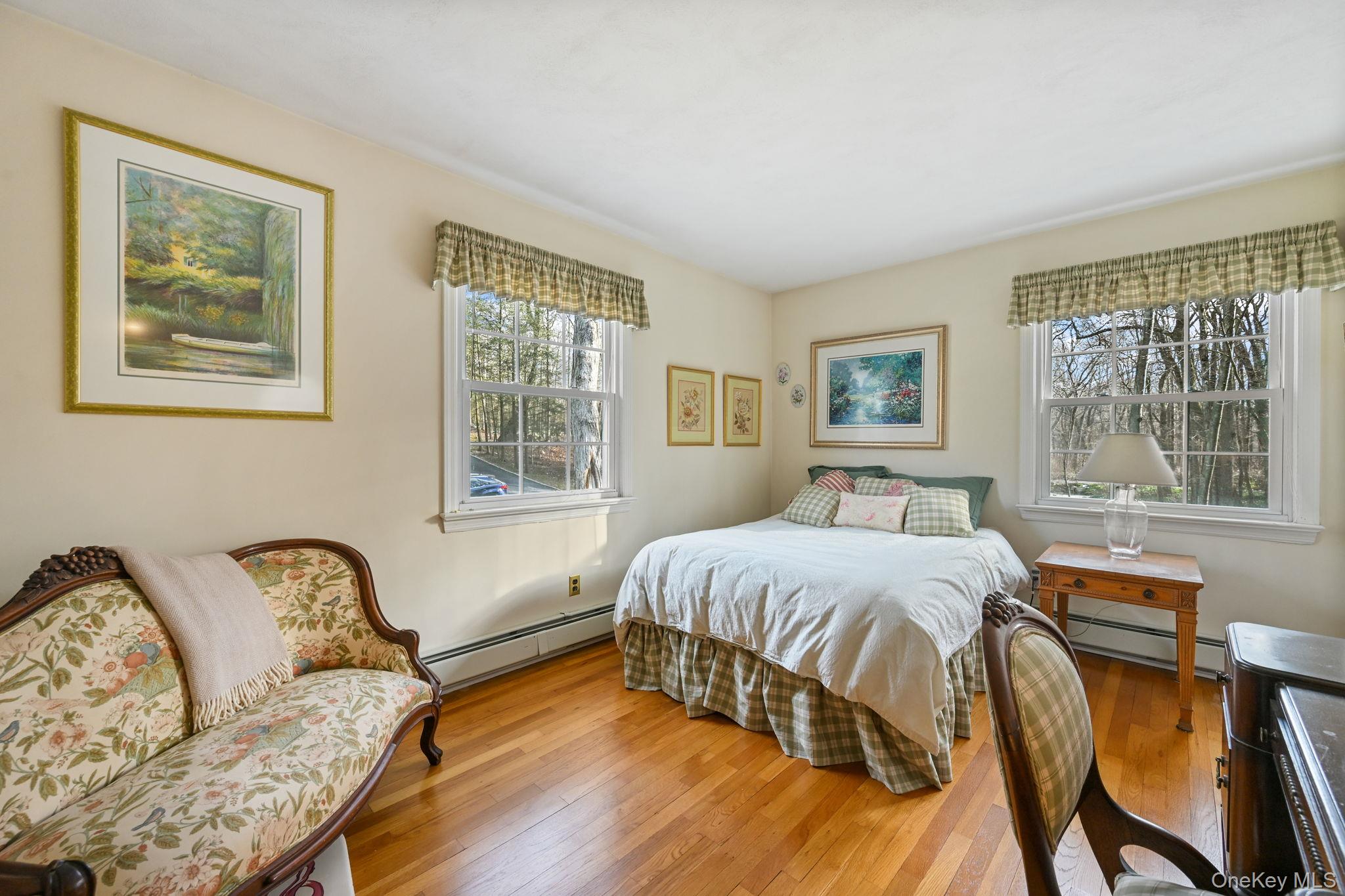 54 Lockwood Road South Salem, NY 10590 - Photo 25 of 46 a bedroom with a bed and wooden floor