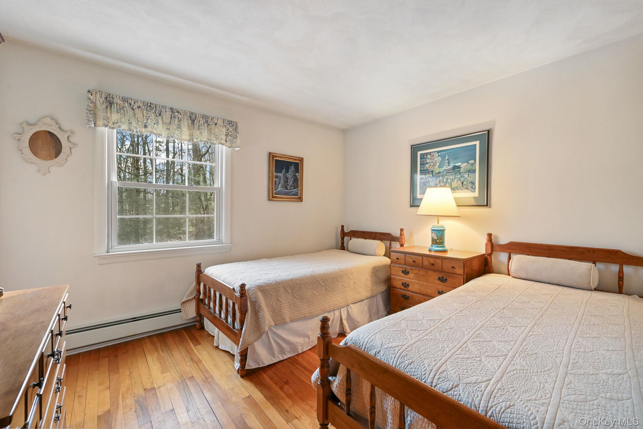 54 Lockwood Road South Salem, NY 10590 - Photo 27 of 46 a bedroom with two beds and a window