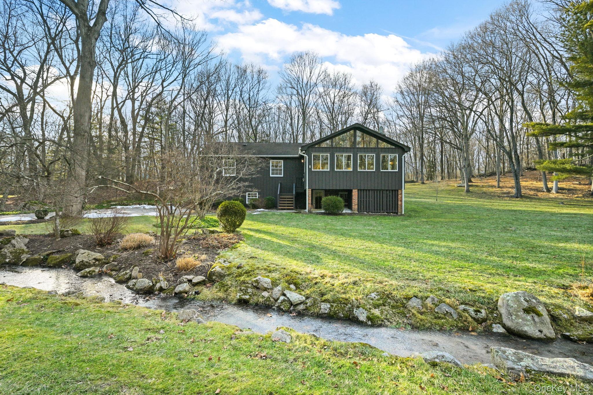 54 Lockwood Road South Salem, NY 10590 - Photo 36 of 46 a front view of a house with garden