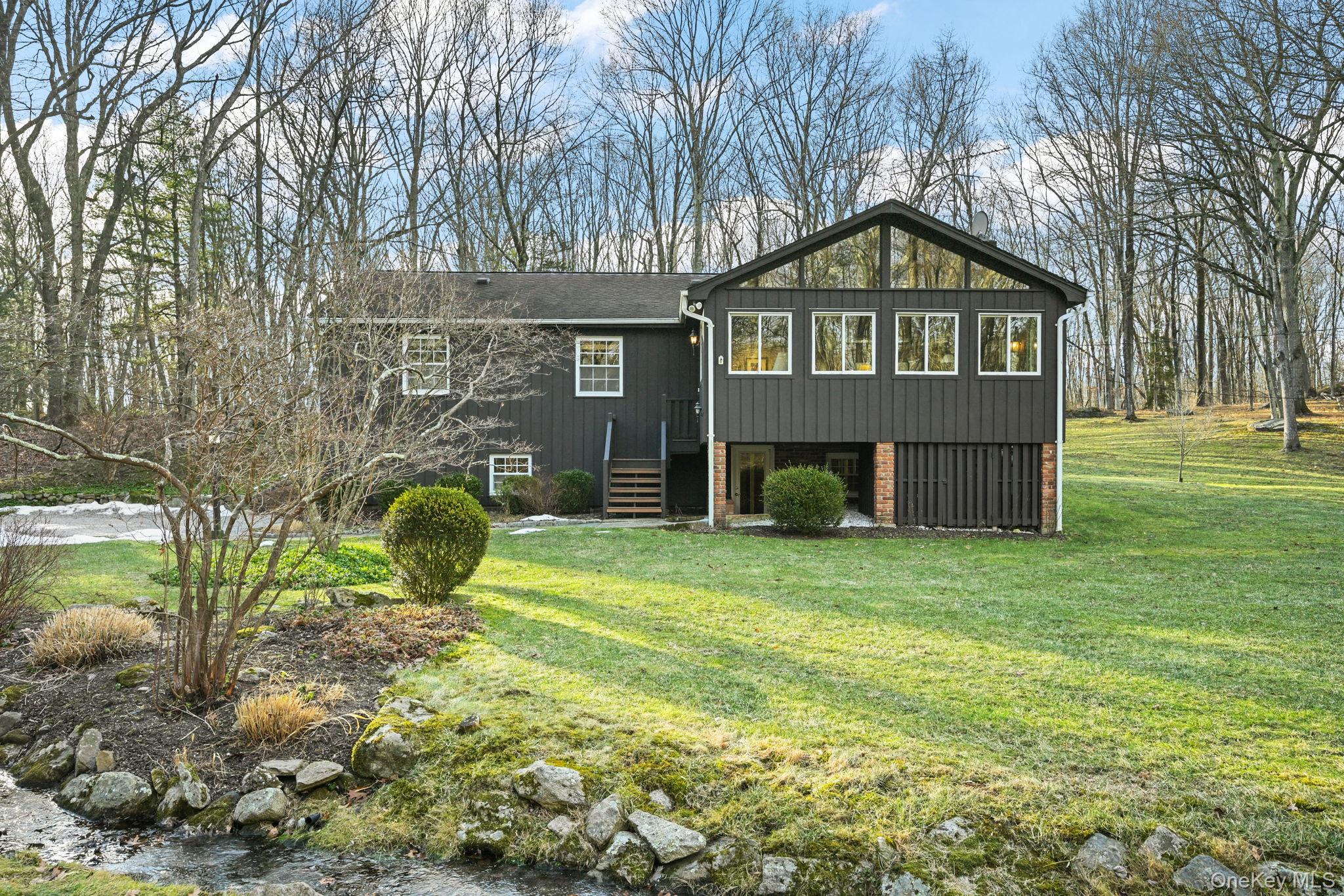 54 Lockwood Road South Salem, NY 10590 - Photo 37 of 46 a front view of a house with a garden