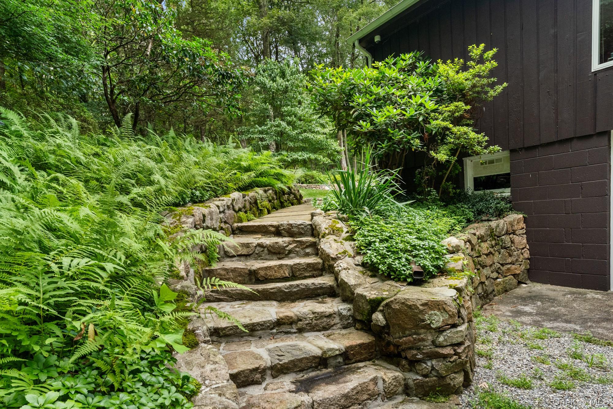 54 Lockwood Road South Salem, NY 10590 - Photo 39 of 46 a view of a garden with plants and large trees