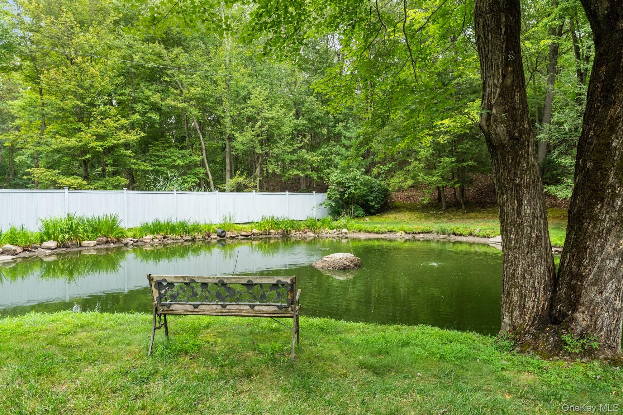 54 Lockwood Road South Salem, NY 10590 - Photo 43 of 46 a view of a garden with a bench