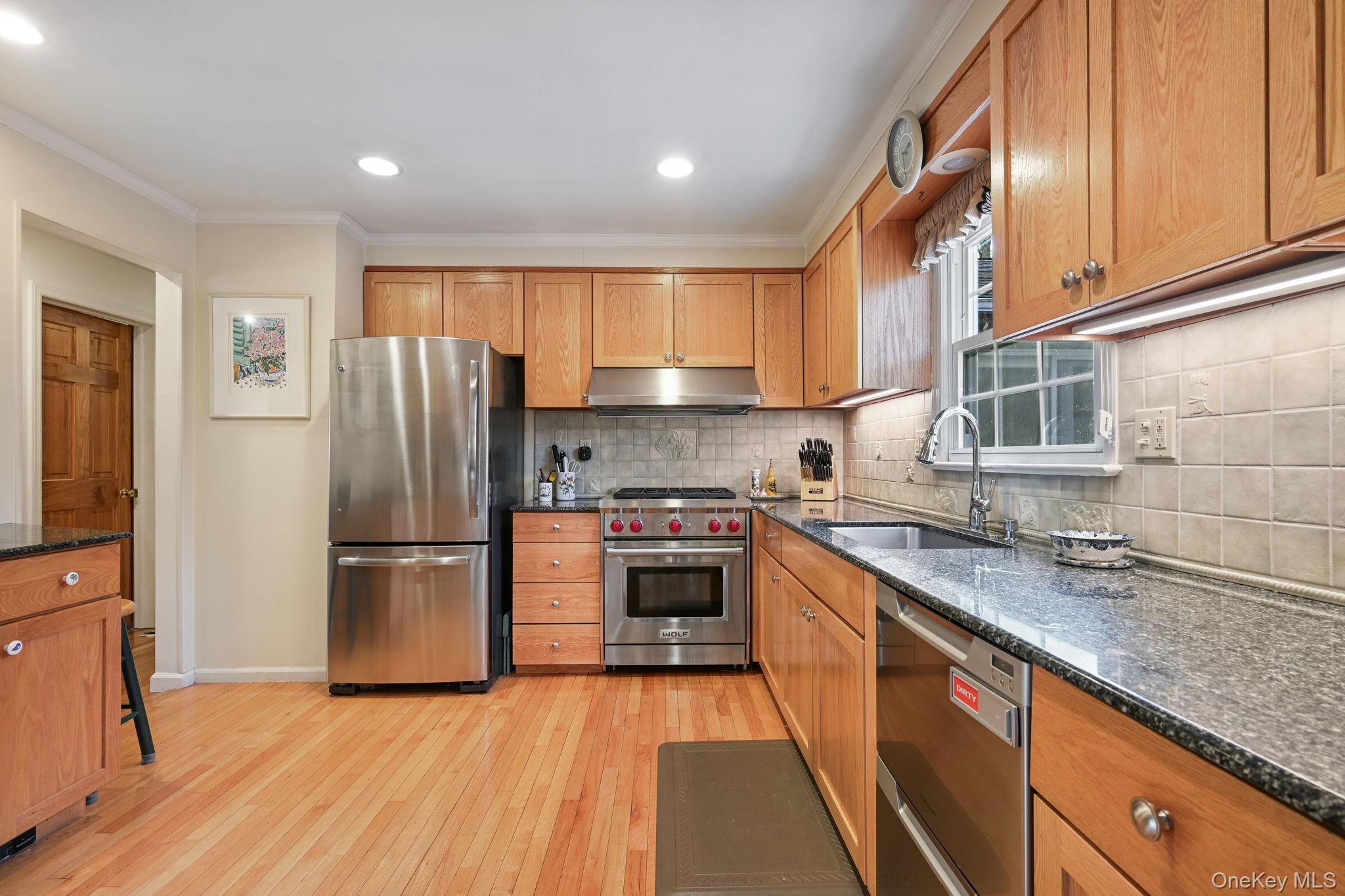 54 Lockwood Road South Salem, NY 10590 - Photo 10 of 46 a kitchen with kitchen island granite countertop a refrigerator stove top oven and sink