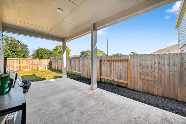 a view of a tub and porch with furniture