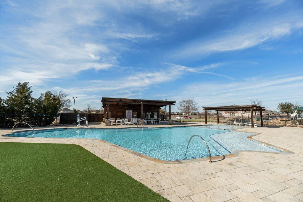 1620 Berry Rdg Trail Aubrey, TX 76227 - Photo 27 of 33 a view of a swimming pool with an outdoor seating