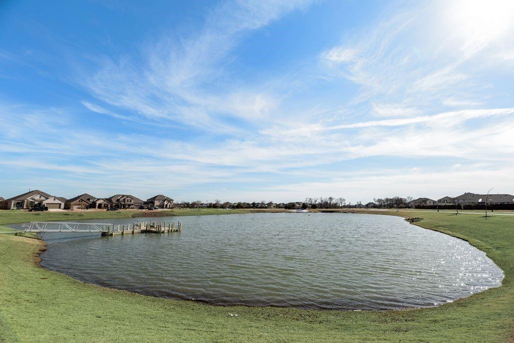 1620 Berry Rdg Trail Aubrey, TX 76227 - Photo 29 of 33 a view of a lake with houses in the background