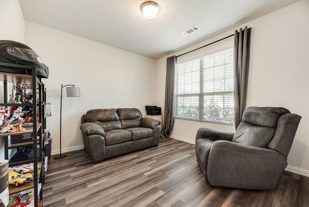1620 Berry Rdg Trail Aubrey, TX 76227 - Photo 5 of 33 a living room with furniture and a window