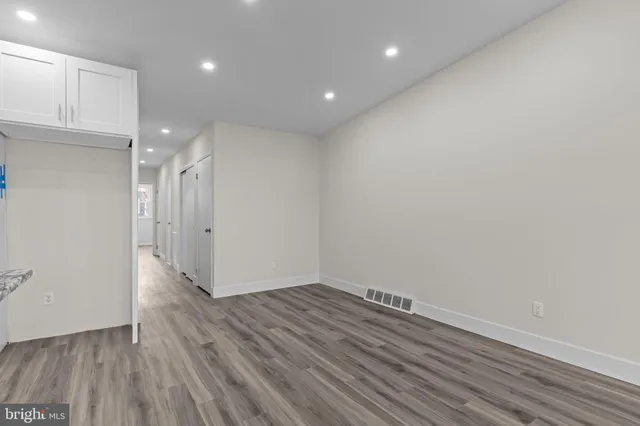 a bed room with a bed and a painting