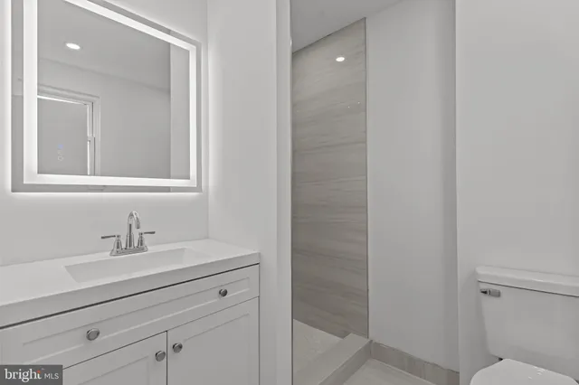 a bathroom with a bathtub and a sink