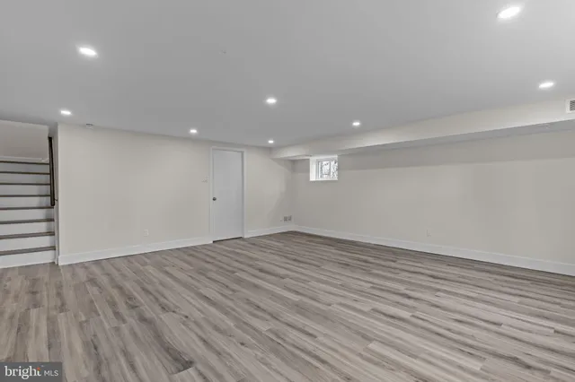 a bathroom with a toilet a sink a vanity and mirror