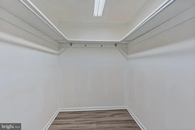 a view of hallway with wooden floor