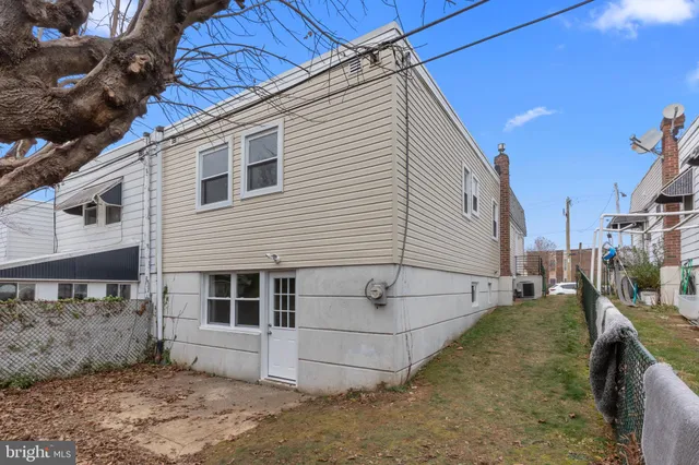 a view of a backyard with furniture