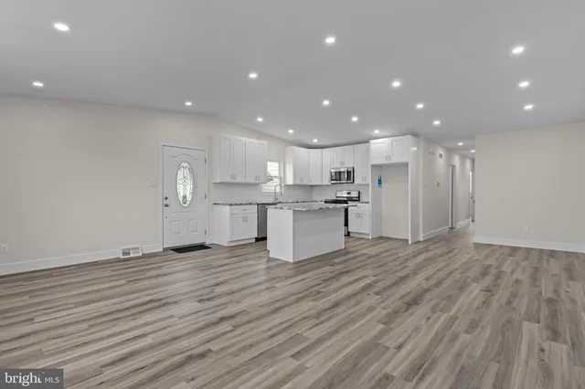 a view of kitchen with wooden floor